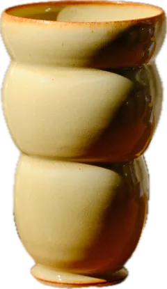 Cream vase with a toasted flash and stacked bulges