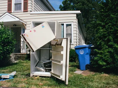 An old fridge left out on a lawn